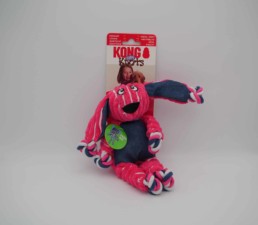 Jouet peluche résistante pour chien KONG Knots en forme de lapin rose, face avant